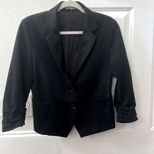 Black express tuxedo jacket. Waist length cropped sleeves. Worn maybe 3x